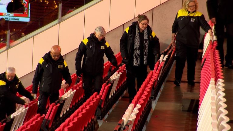 Stewards check the seats