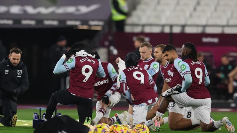 Solidarity jerseys: West Ham players show their support for their teammate Michail Antonio.