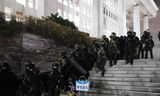 Military personnel withdraw from parliament in Seoul, South Korea, after a state of emergency declared by the president was reversed by parliament. 