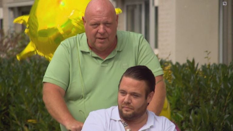 Father Peter and his son Mark come home from the hospital together
