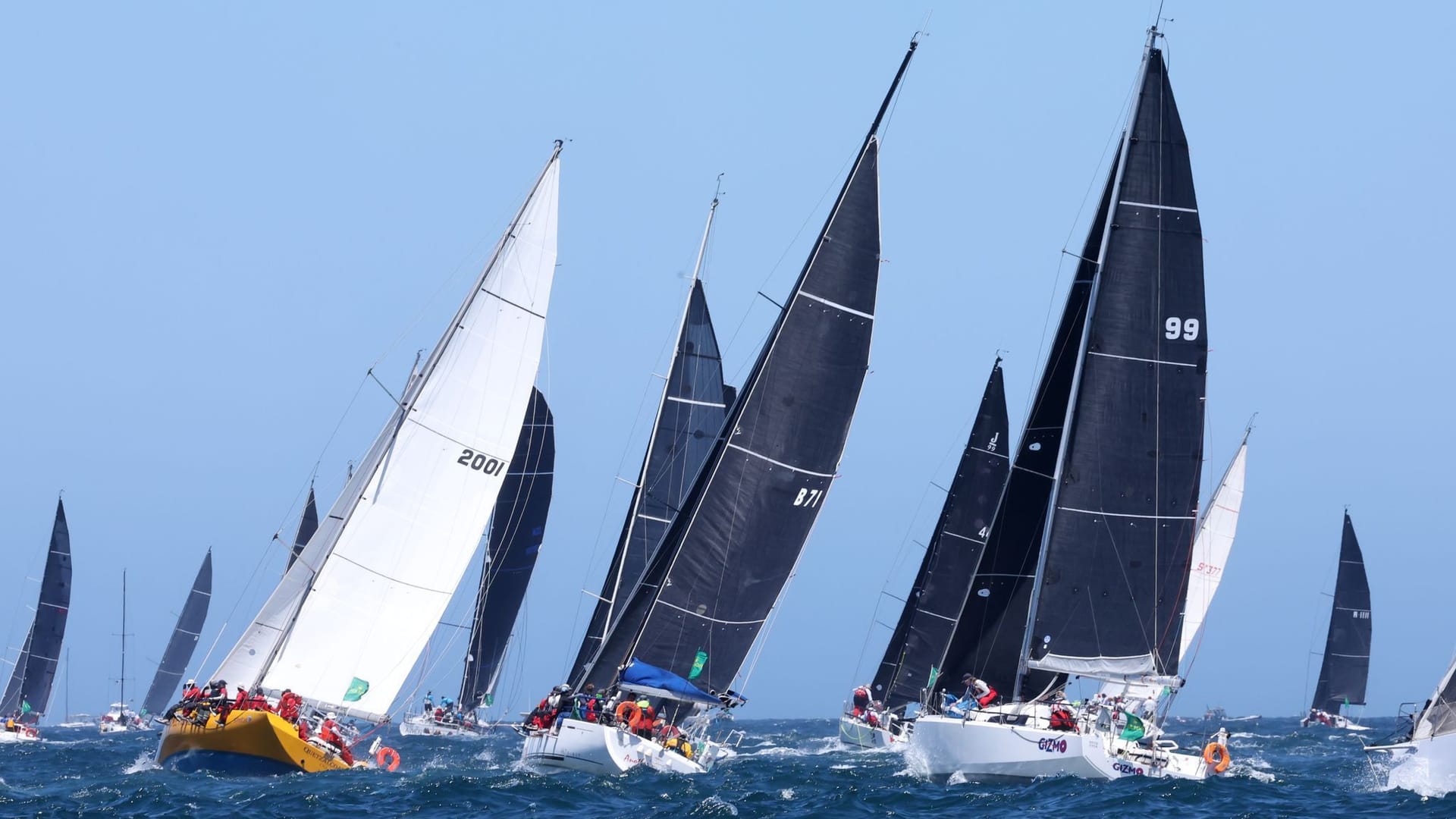 The fleet leaves the Sydney Heads during the 2024 Sydney Hobart Yacht Race in Sydney. According to the organizers, two crew members from different yachts died in the traditional sailing regatta. The fleet leaves the Sydney Heads during the 2024 Sydney Hobart Yacht Race in Sydney. According to the organizers, two crew members from different yachts died in the traditional sailing regatta.