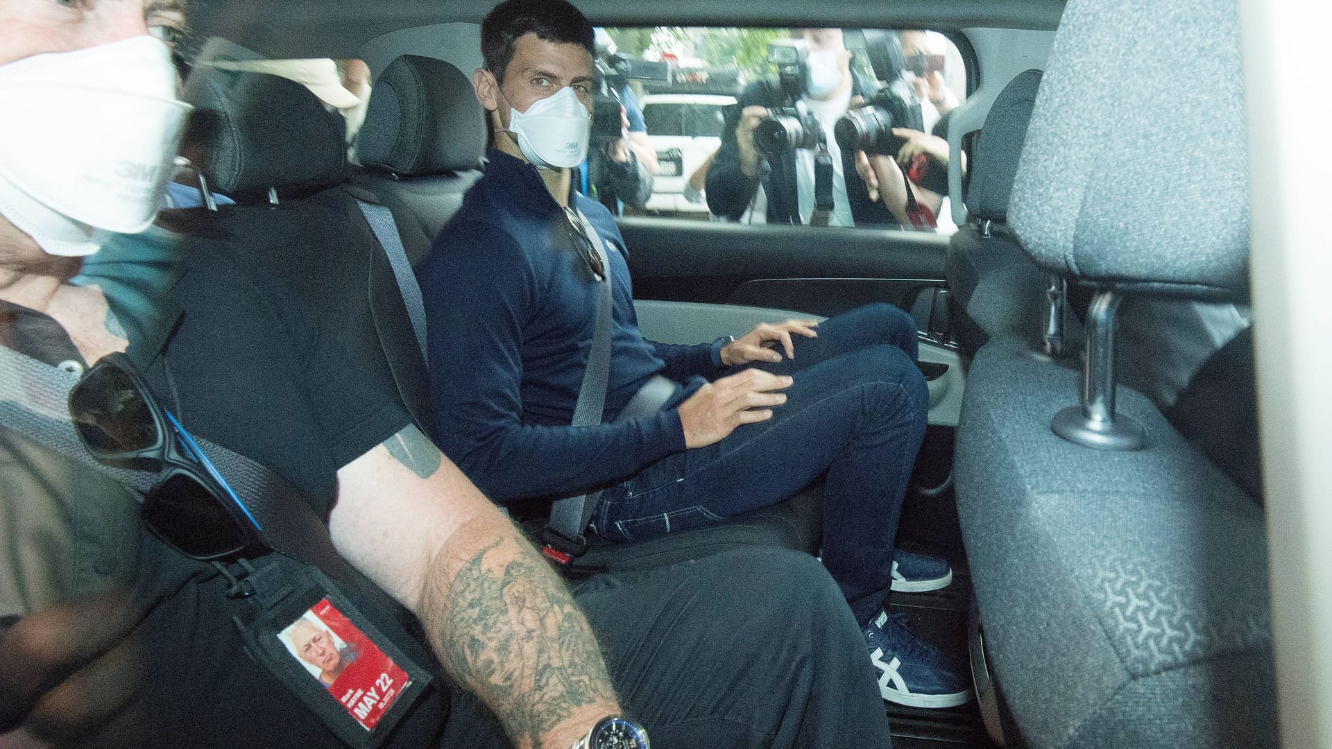 Quarantined for weeks: Djokovic and a companion in Melbourne in 2022.