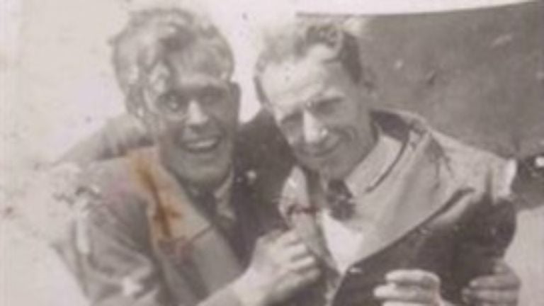 An old photo with two men. 