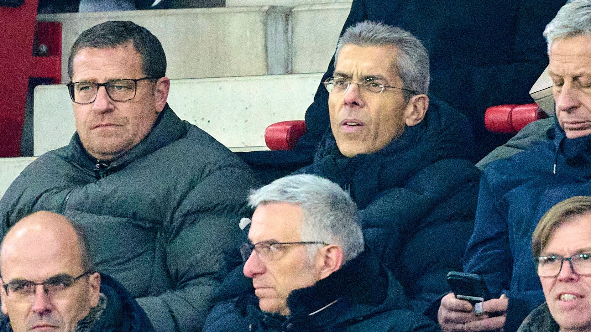 Michael Diederich (r.) next to sports director Max Eberl in the stands at an FC Bayern game.