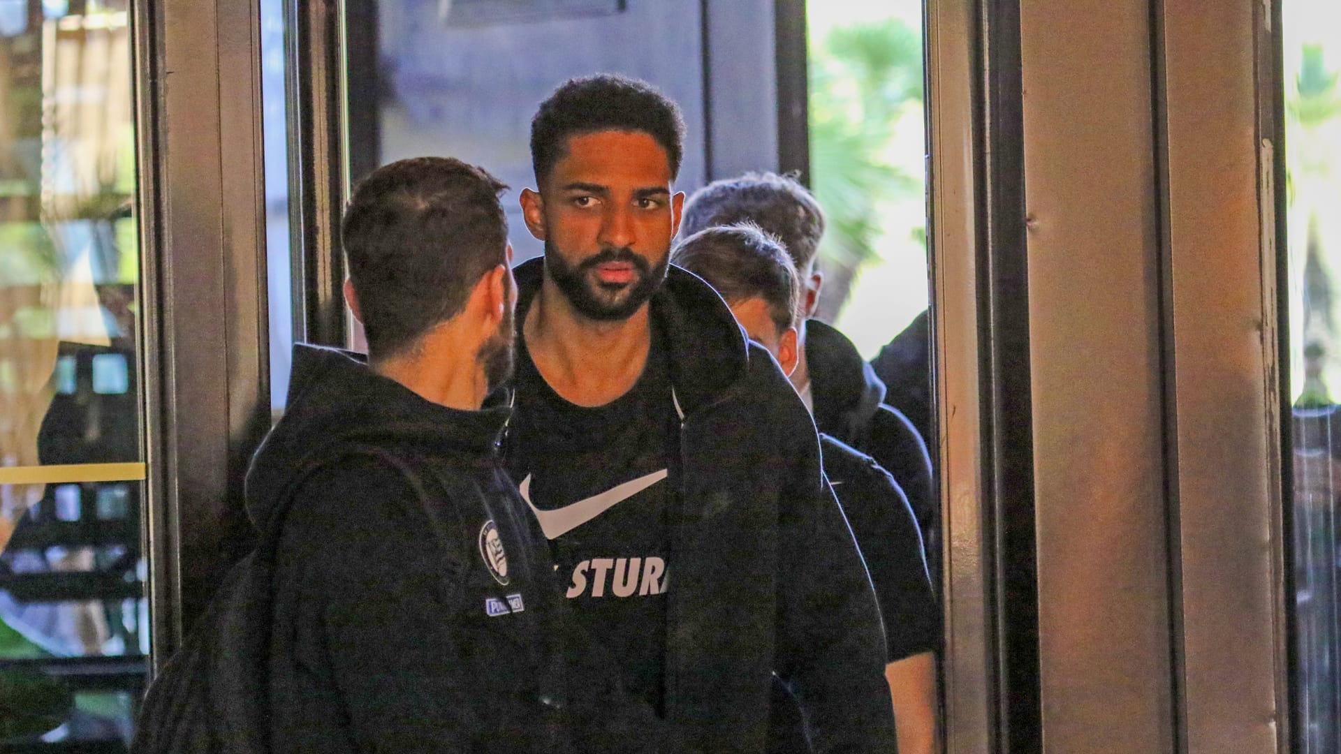 Gregory Wüthrich from Sturm Graz checks into the 1. FC Köln team hotel.