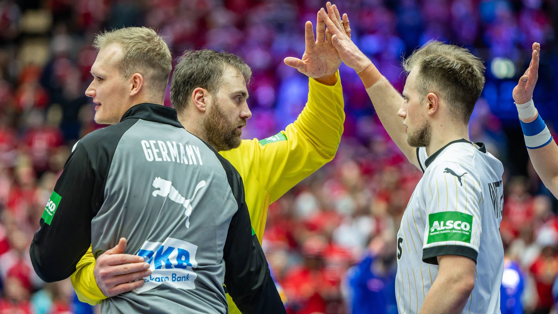 Germany's handball players high-five each other: They won an important victory against Italy. Germany's handball players high-five each other: They won an important victory against Italy.
