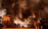 Smoke and flames in a shopping area on the west side of Los Angeles. 