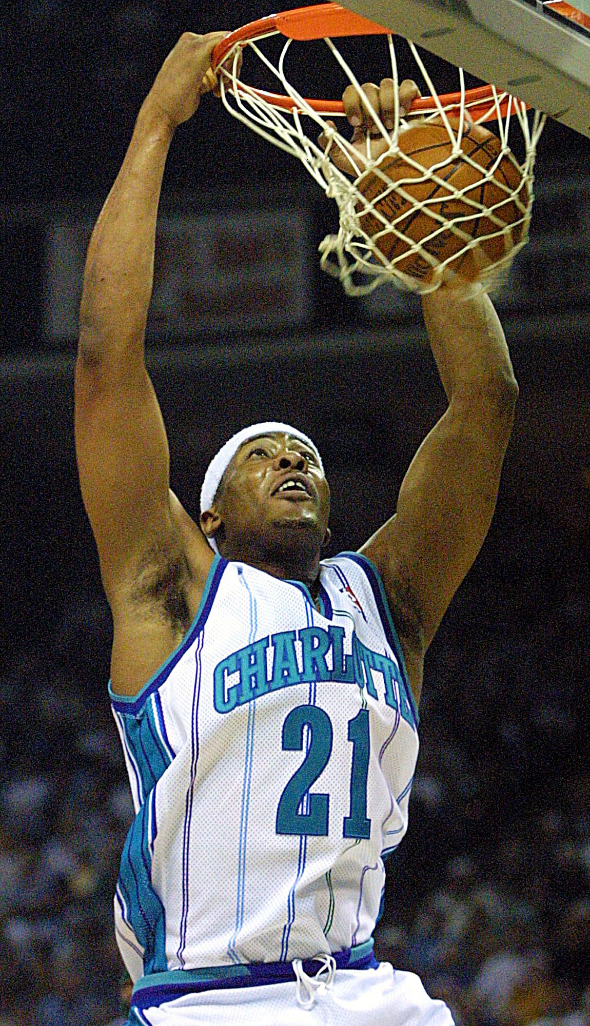 Charlotte Hornet Jamaal Magloire Dunks Against The Milwaukee Bucks in the First Half of Game 3 of the Second Round Eastern Conference Playoffs at the Charlotte Coliseum in Charlotte, 10 May 2001. Afp Photo / in the Redmond (photo by Redmond / AFP)