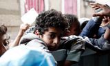 Food is distributed at a local charity center in Sana'a, Yemen. In Yemen,