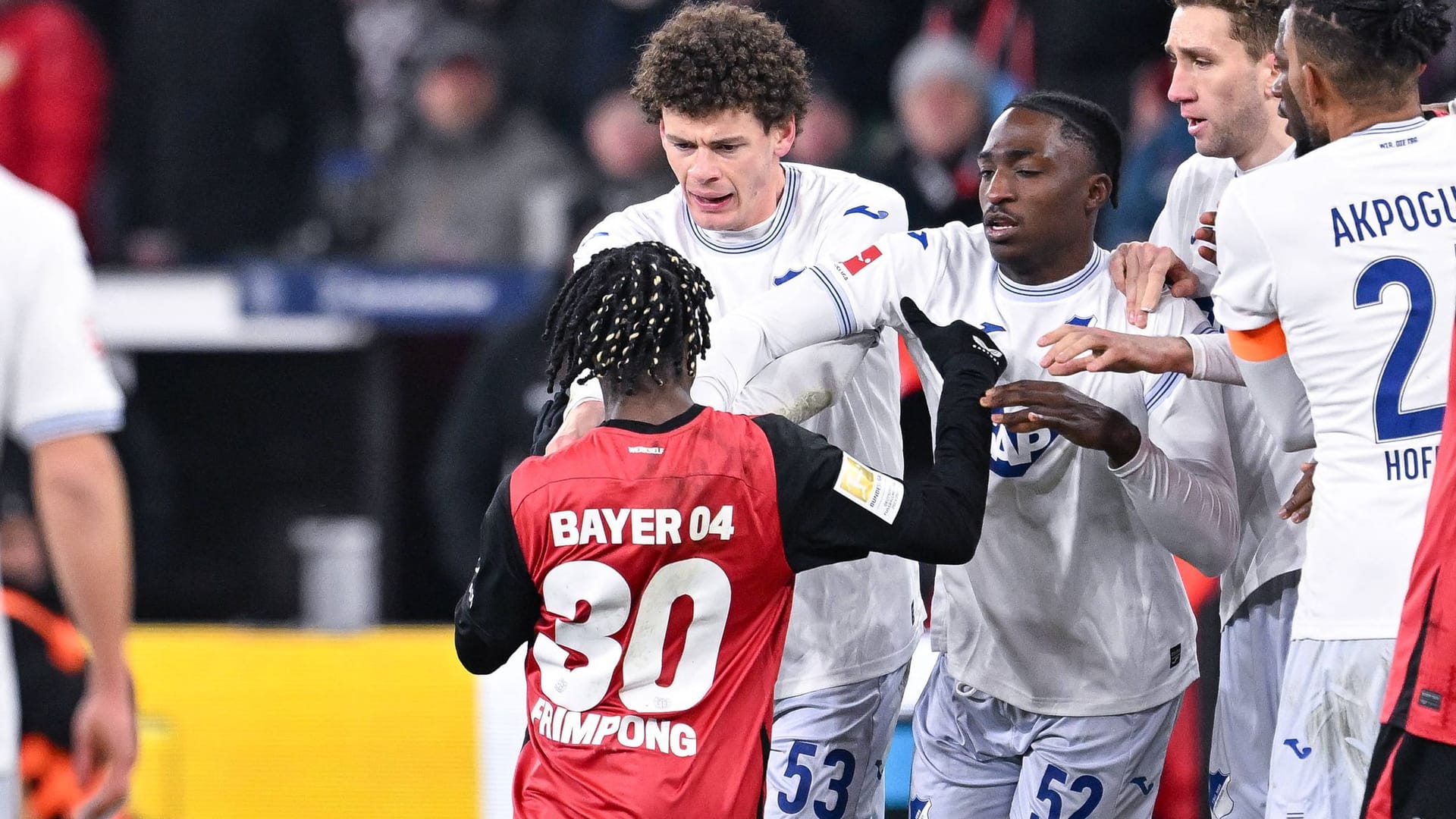 Heated minds: Leverkusens Frimpong opposes the Hoffenheimers.