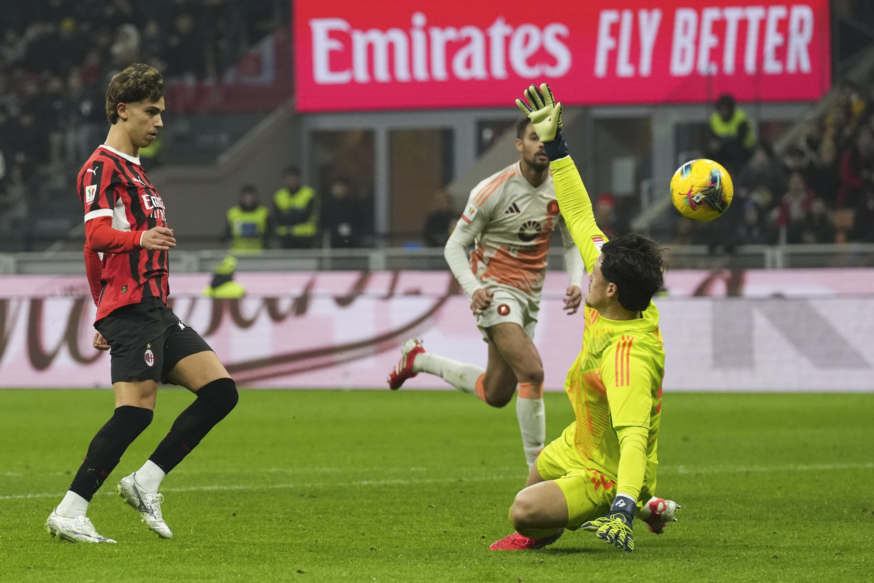 AC Milan's Joao Felix, Left, Scores His Side's Third Goal During An Italian Cup Quarterfinal Soccer Match Bethaeen AC Milan and Rome at the San Siro Stadium, in Milan, Italy, Wednesday, Feb. 5, 2025. (AP photo/Antonio Calanni)