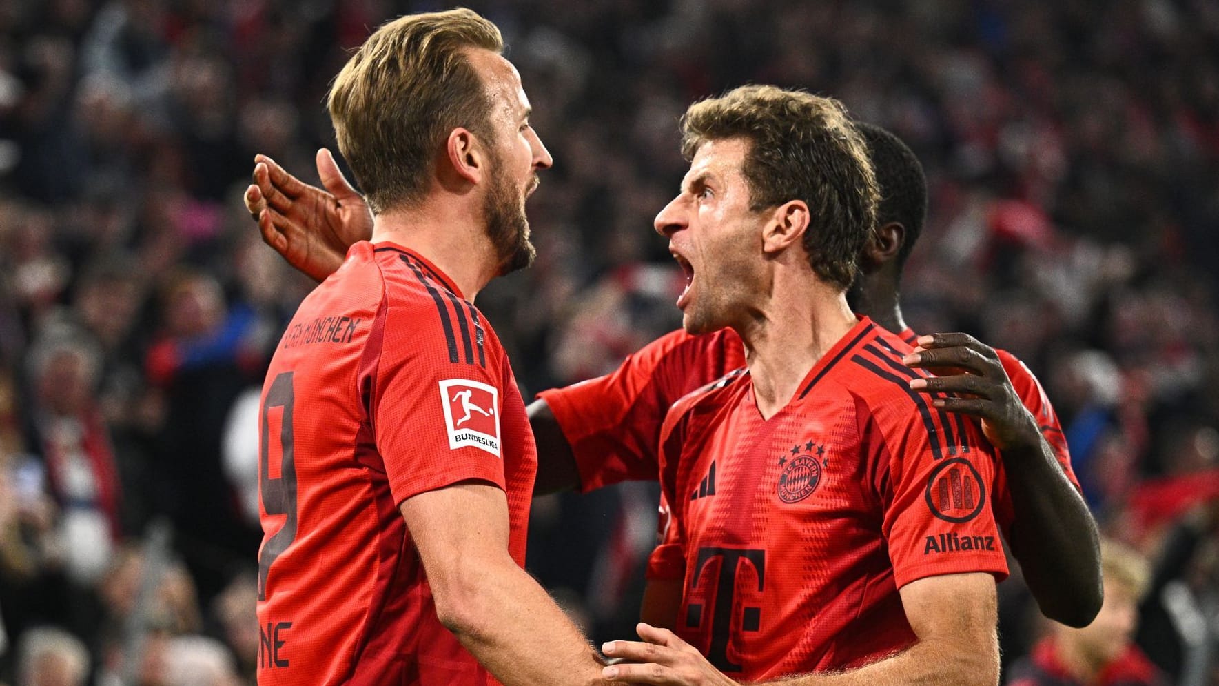 Unlettable cheers: Bavaria's striker Harry Kane (left) and team -mate Thomas Müller in the game against VfB Stuttgart.