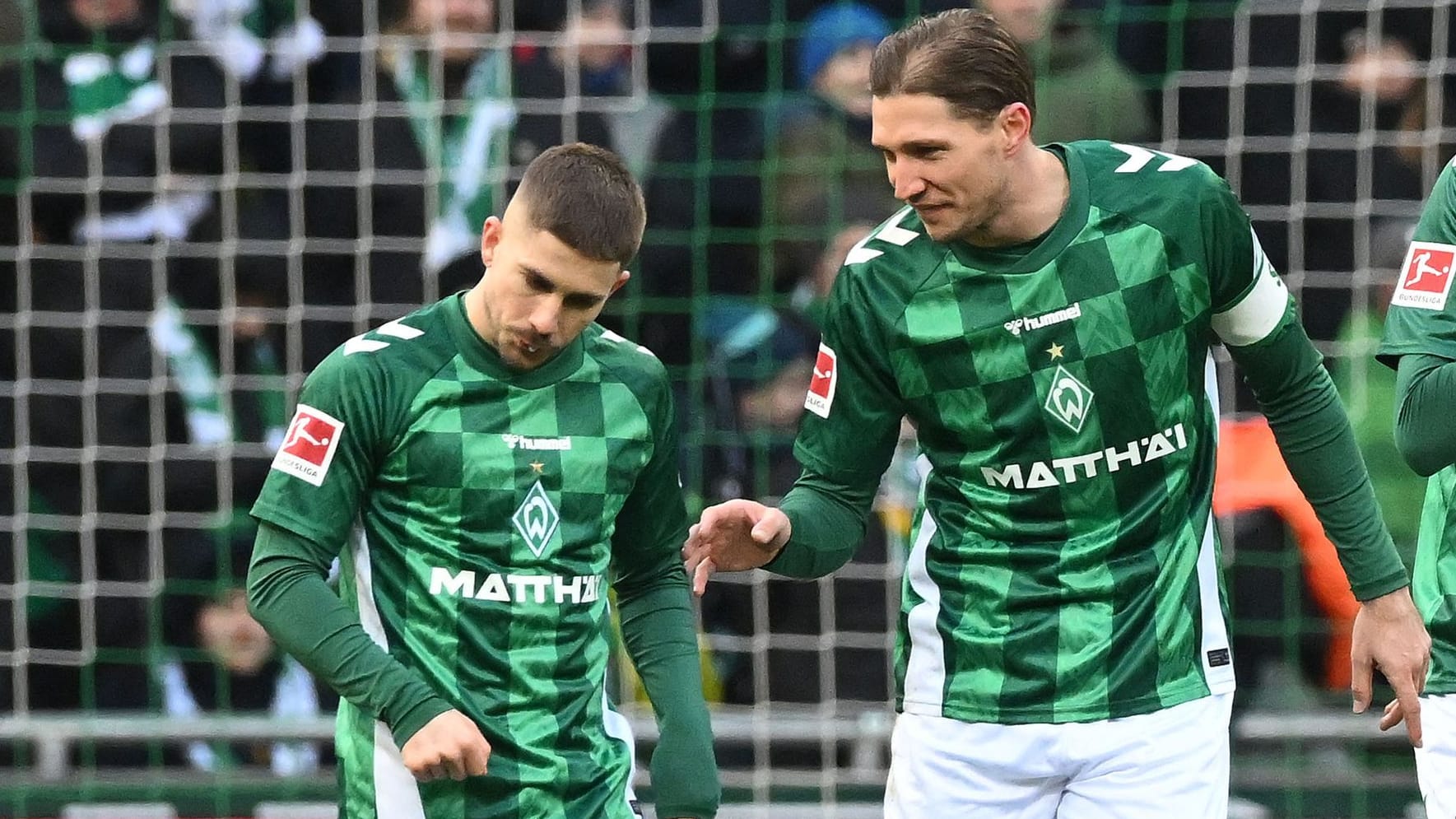 Disappointed: Bremen's Schmid (left) and strong in the game against TSG Hoffenheim.