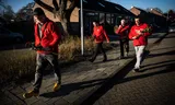 Wietze Potze, leader of the PvdA in Westerwolde, on a campaign for the 2022 municipal elections. He visits the doors in Blijham to give voters a red rose. 