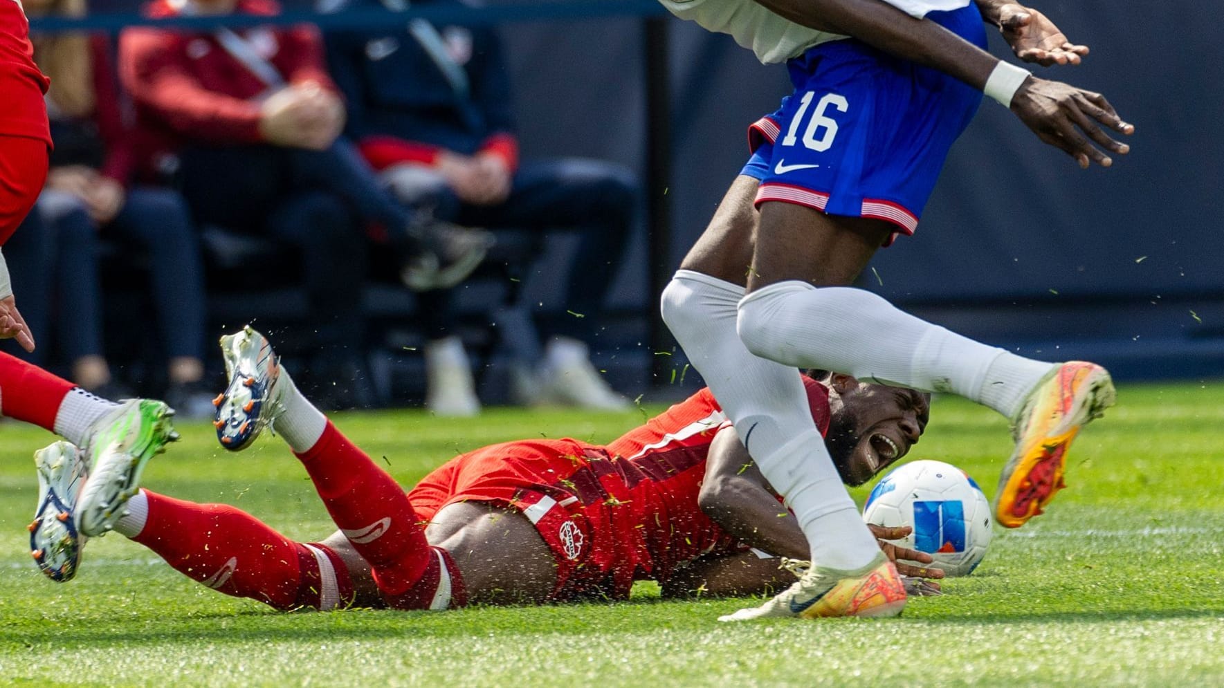 On the ground: Alphonso Davies in the game against the USA. The Canadian will be missing from Bayern for a long time.