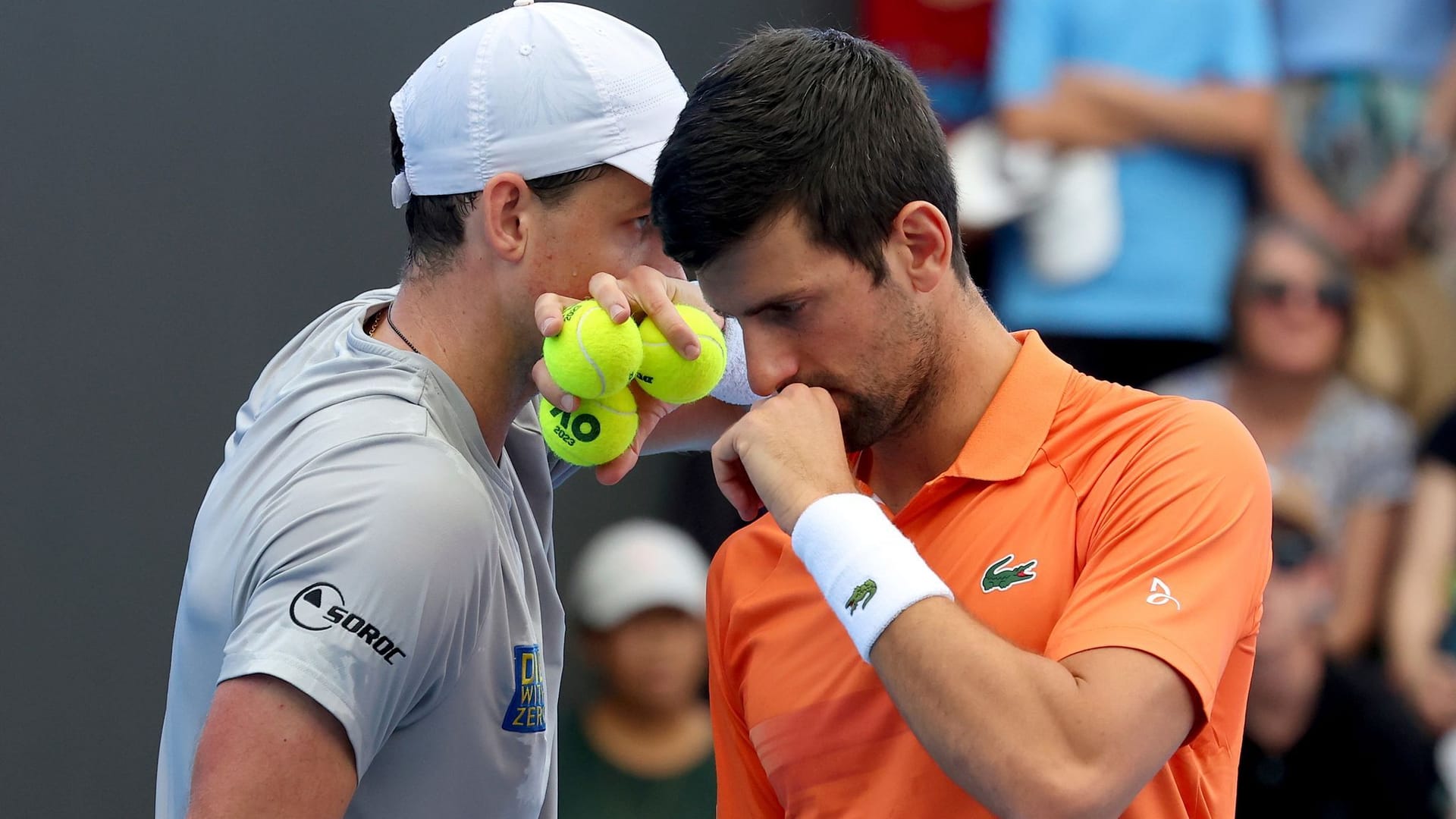 Novak Djokovic (R) and Vasek Pospisil