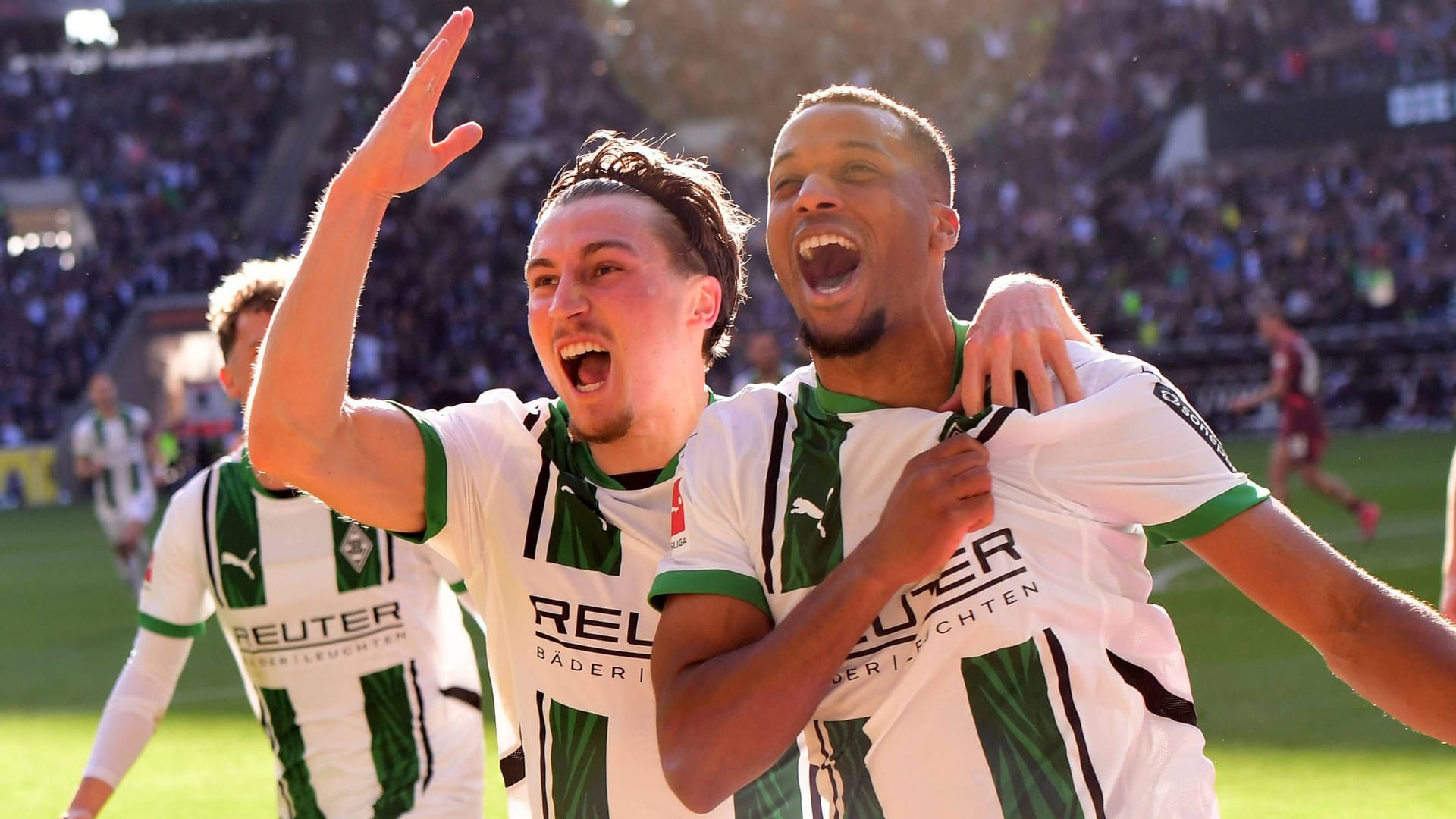 The winning goal: Gladbach's Pléa (right) celebrates Reitz with teammate. The winning goal: Gladbach's Pléa (right) celebrates Reitz with teammate.