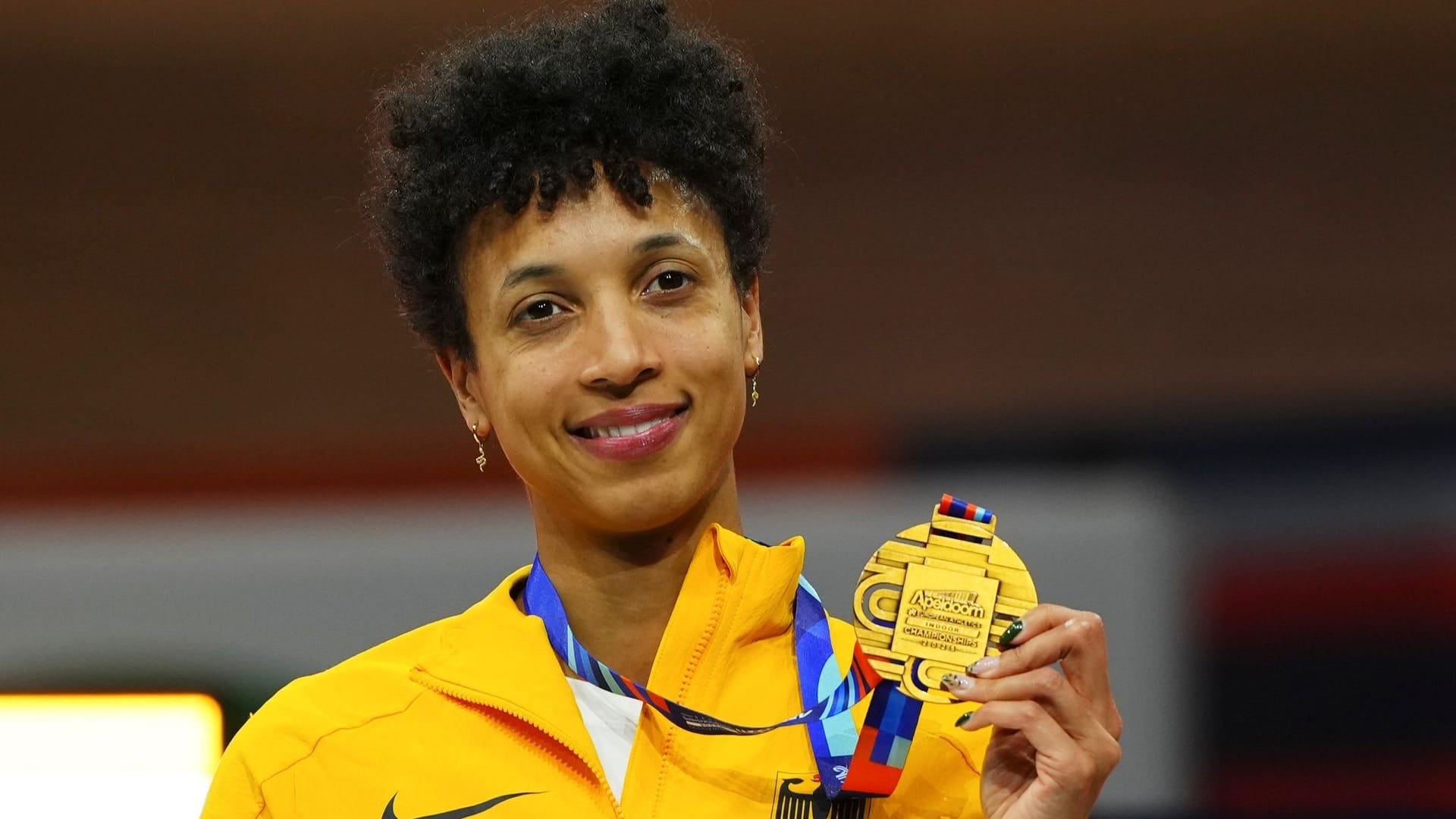 Malaika Mihambo from Germany is on the podium with her bronze medal in the long jump.
