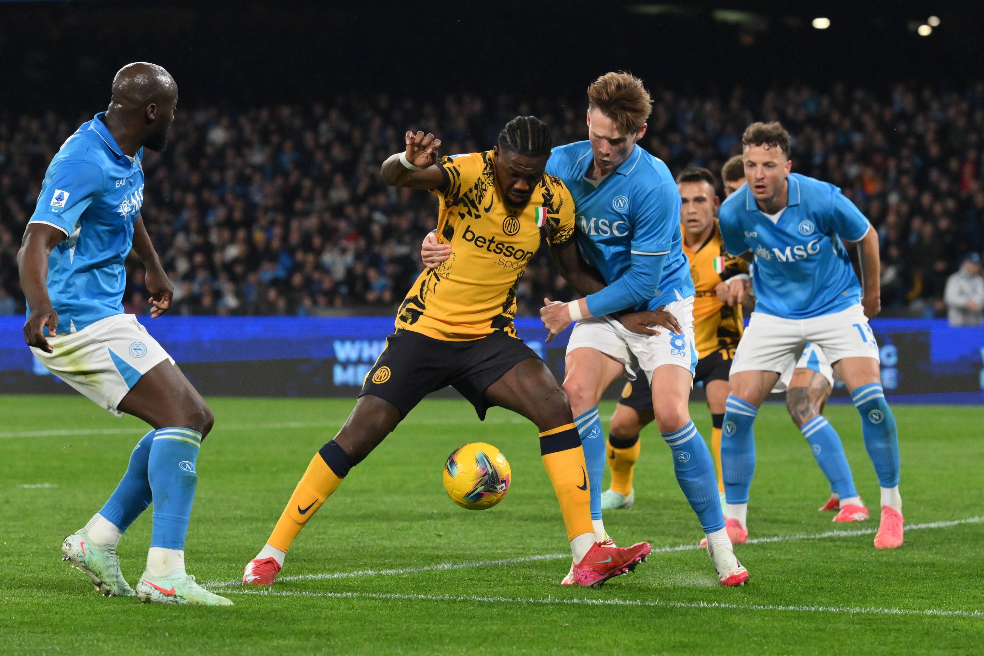 Inter Milands Marcus Thuram and Naples Scott Mctominay fight for the ball