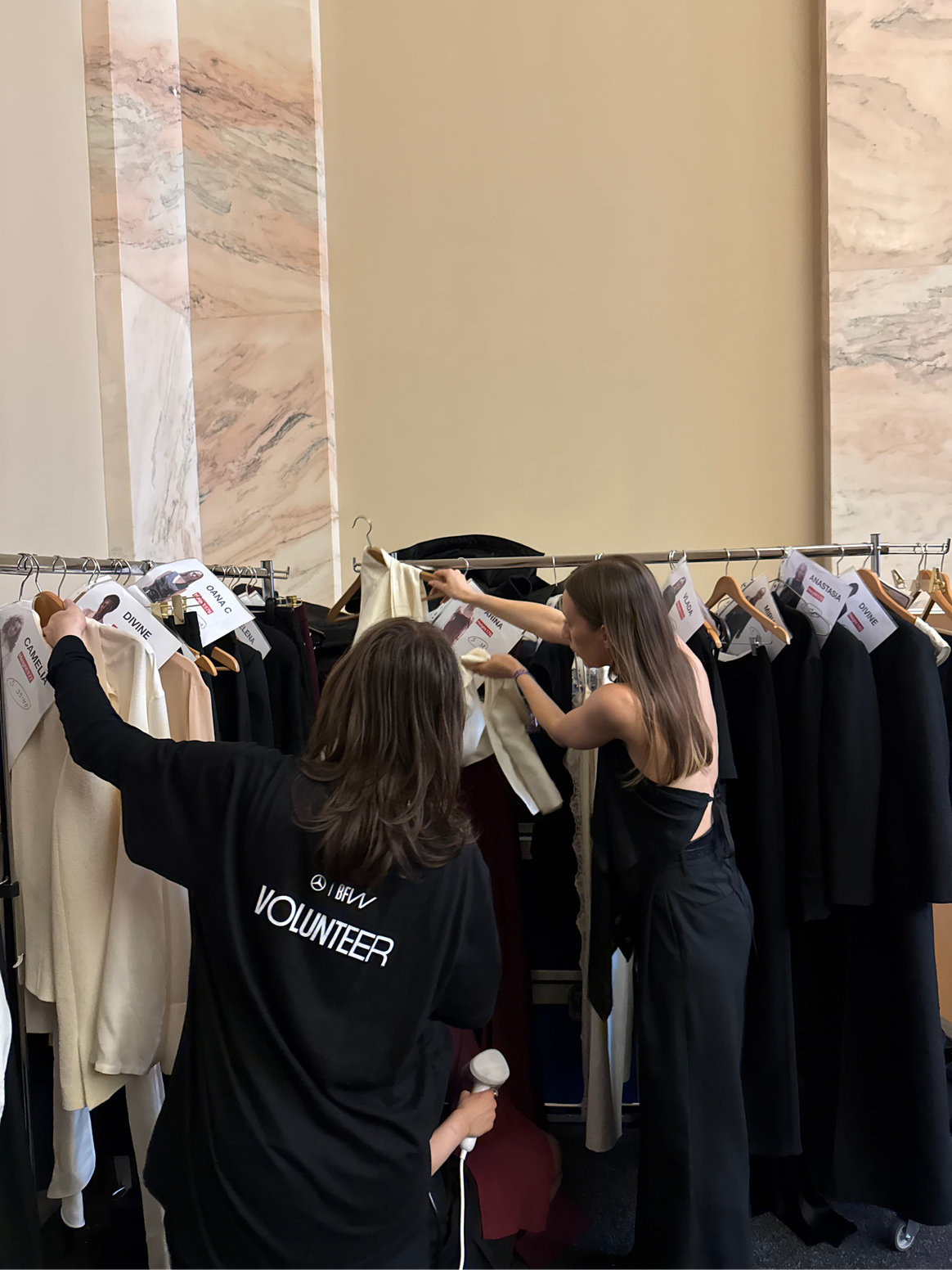 Violet, designer of RXquette, meets the final preparations in the MBBFW backstage area.