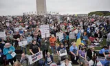 Protesting protesters against US President Donald Trump and his adviser Elon Musk during a 'Hands Off!'-Demonstration on the site of the Washington Monument in Washington.
