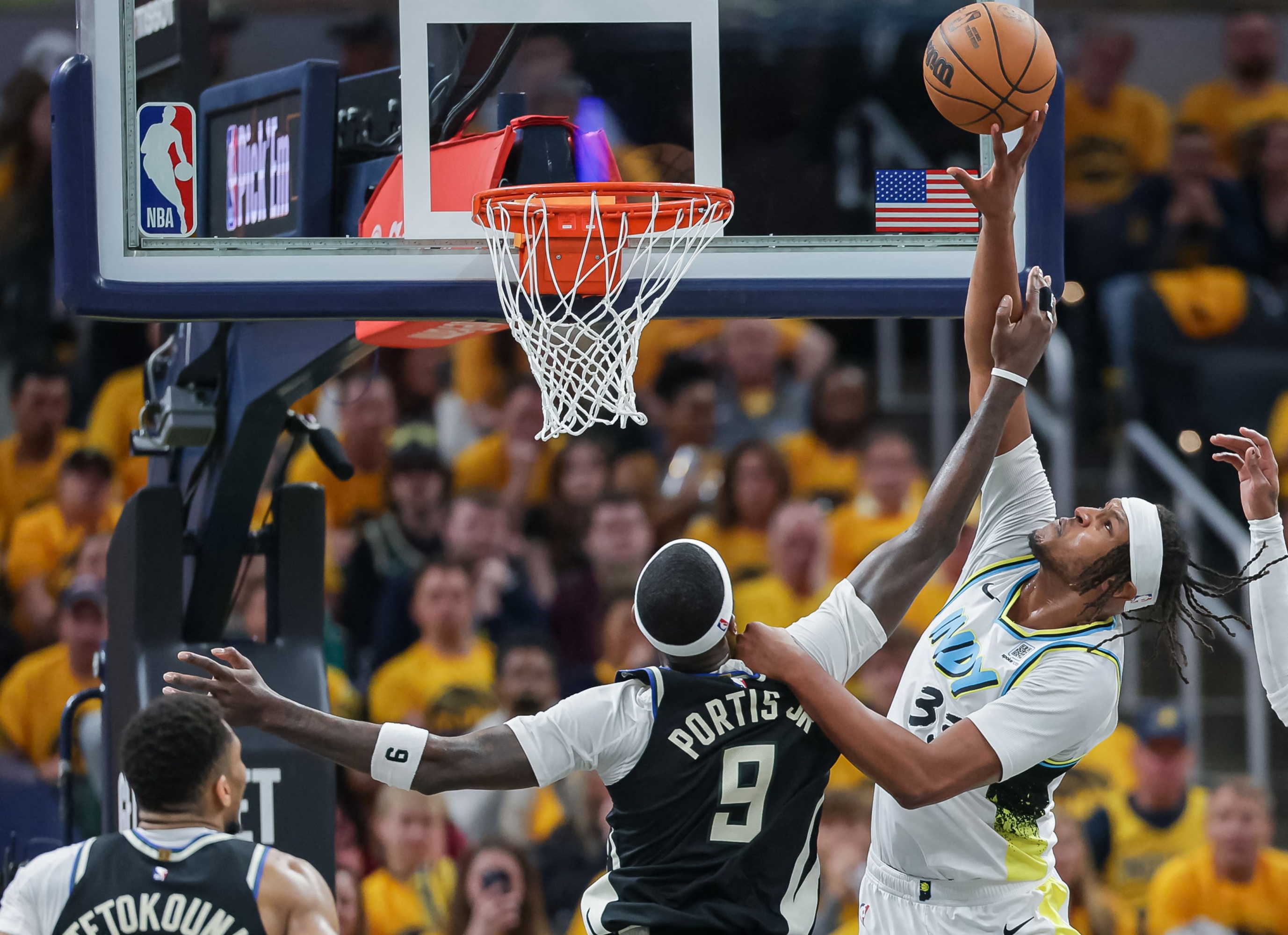 Indianapolis, Indiana - April 19: Myles Turner #33 of the Indiana Pacers Shoots The Ball Against Bobby Portis #9 of the Milwaukee Bucks During the Fouting Quarter in Game One of the NBA Playoffs at Gainbridge Fieldhouse on April 19, 2025 in Indianapolis, Indian. Notes to User: User Expressly Acknowledges and Agrees That, by Downloading and or Using This Photograph, User is allowed to the Terms and Conditions of the Getty Images License Agreement. Michael Hickey / Getty Images / AFP (Photo by Michael Hickey / Getty Images North America / Getty Images Via AFP)