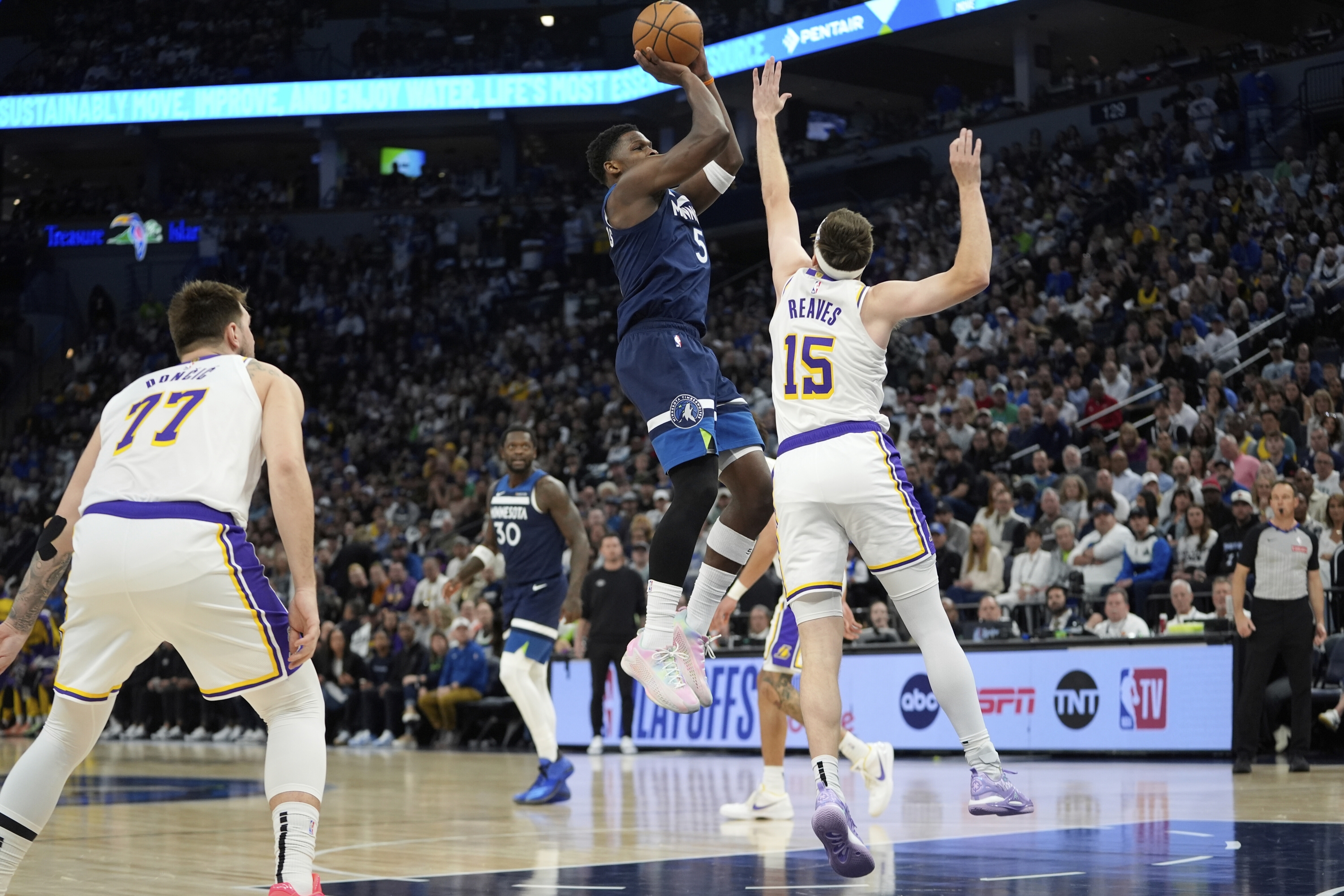 Minnesota Timberwolves Guard Anthony Edwards (5) Shoots Over Los Angeles Lakers Guard Austin Reaves (15) During the First Half of Game 4 of an NBA Basketball First-Rirst-Round Playoff Series, Sunday, April 27, 2025, in Minneapolis. (AP Photo/Abbie Parr)