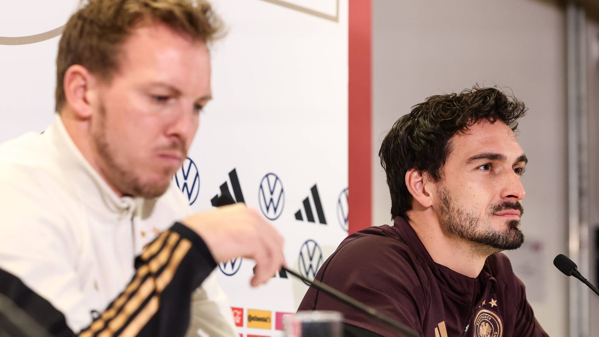 Julian Nagelsmann and Mats Hummels (right) at a press conference.
