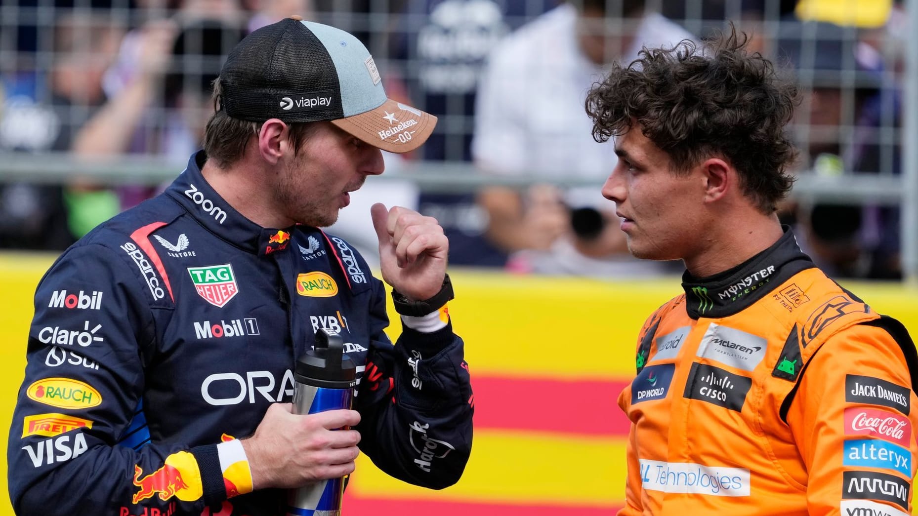 Max Verstappen and Lando Norris (R)