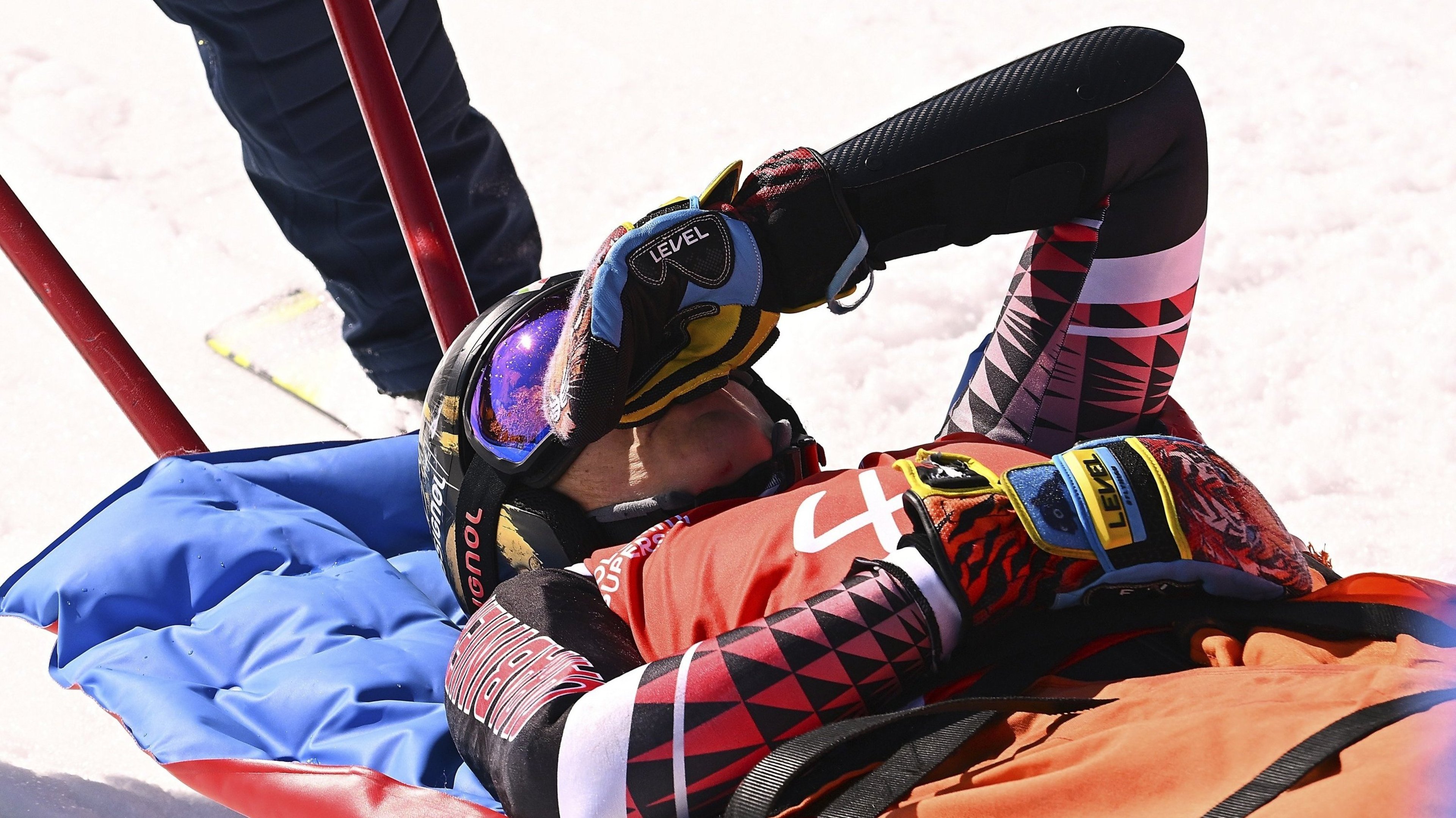 The Italian Federica Brignone is carried away on a sled after falling in the Lusia ski area in the Fassatal ski area with a giant slalom