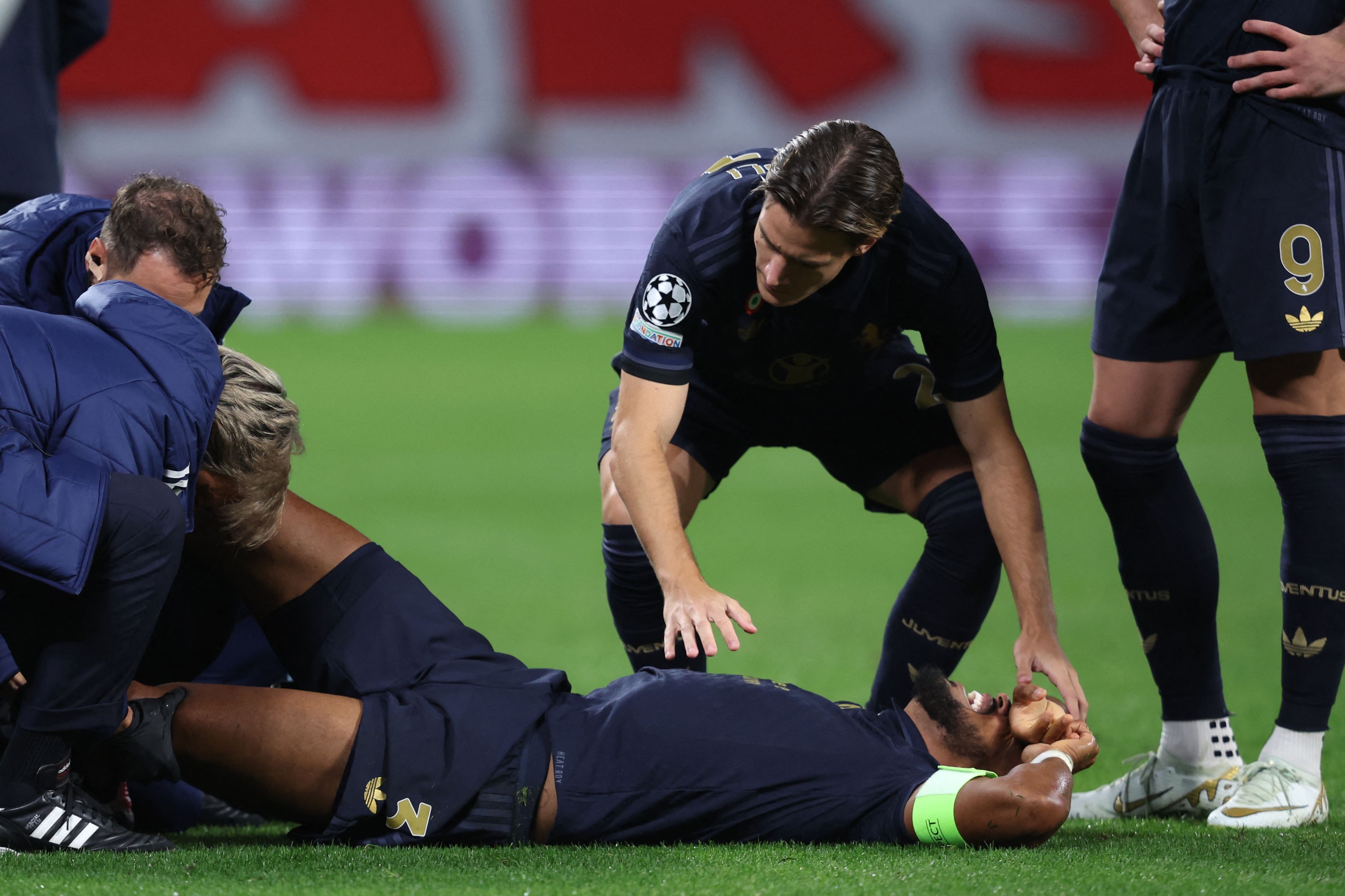Juventus' Brazilian Defender #03 Bremer Lies On The Football Pitch After Picking Up An Injury During the UEFA Champions League Football Match Bethaeen RB Leipzig and Juventus FC at the Red Bull Arena in Leipzig On October 2, 2024. (Photo by Ronny Hartmann / AFP)