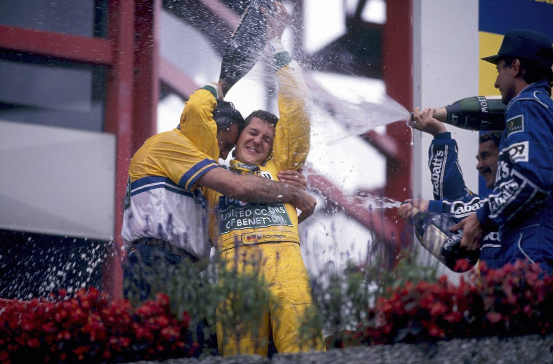 Michael Schumacher celebrates with Flavio Briatore: Schumacher won two World Cup titles in Benetton.