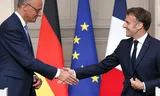 The German Chancellor Friedrich Merz and French President Emmanuel Macron shake their hand at the end of a joint press conference in the Élysée in Paris, France.