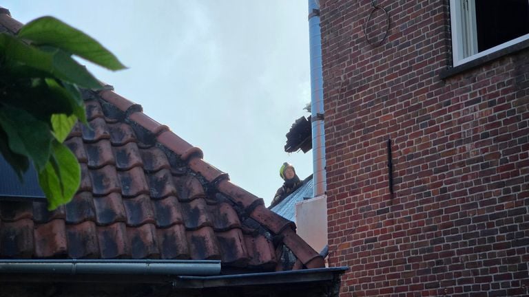 The fire brigade had to partly demolish the back of the building to get closer to the fire (photo: Noël van Hooft).