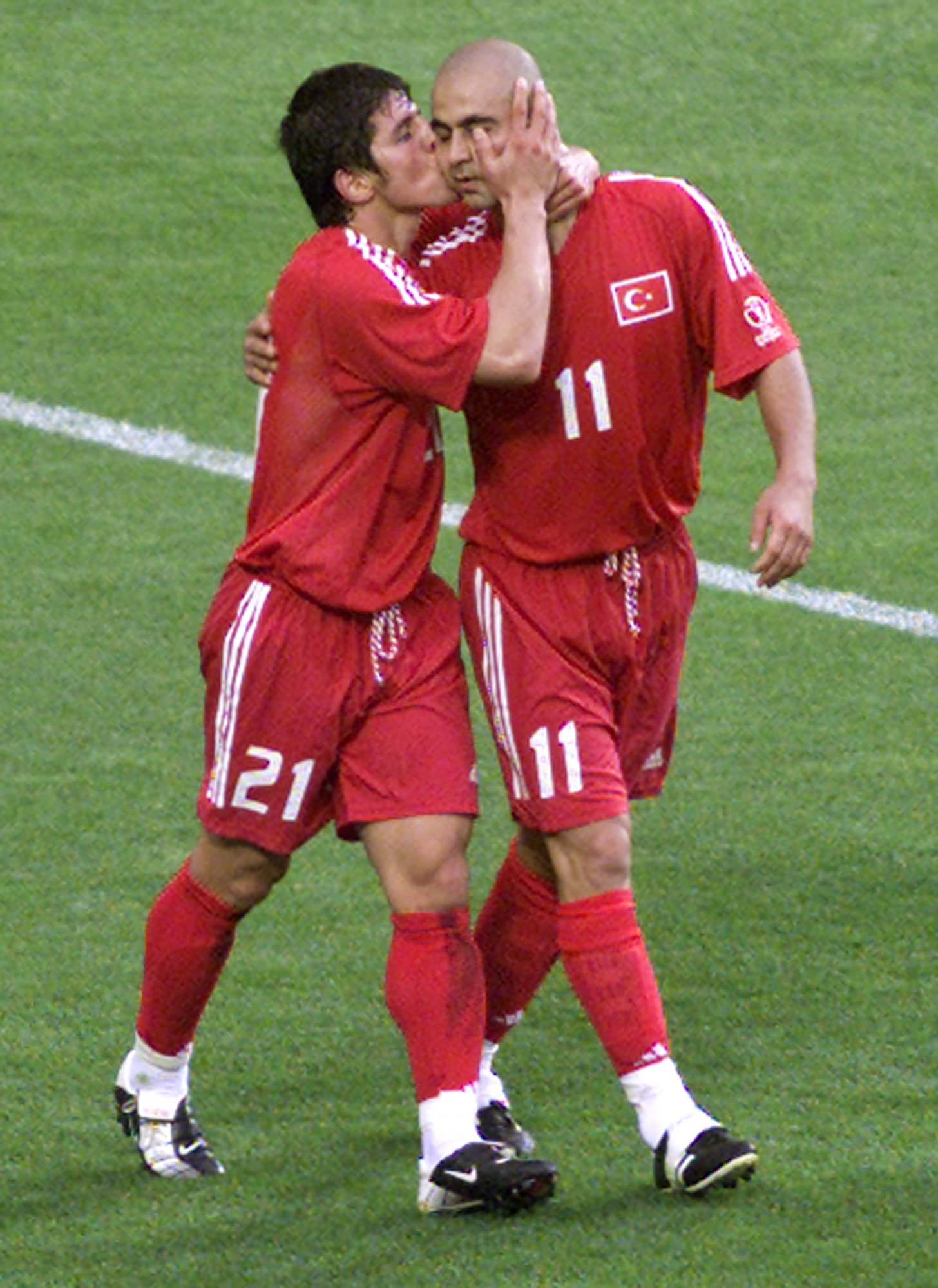 Brazil VS Turkey EMRE Bacia Hasan Sas * Turkey's Hasan Sas, Right, Receives a Kiss from Teammate Emre Belozoglu After He Scored the 1-0 for His Team During the Brazil Versus Turkey, Group C, 2002 World Cup Soccer Match at the Munsu Football Stadium in Unsan, South, South Korea, Monday June 3, 2002. The Other Teams in Group C are china and Costa Rica. (Ap photo/Herbert Knosowski)