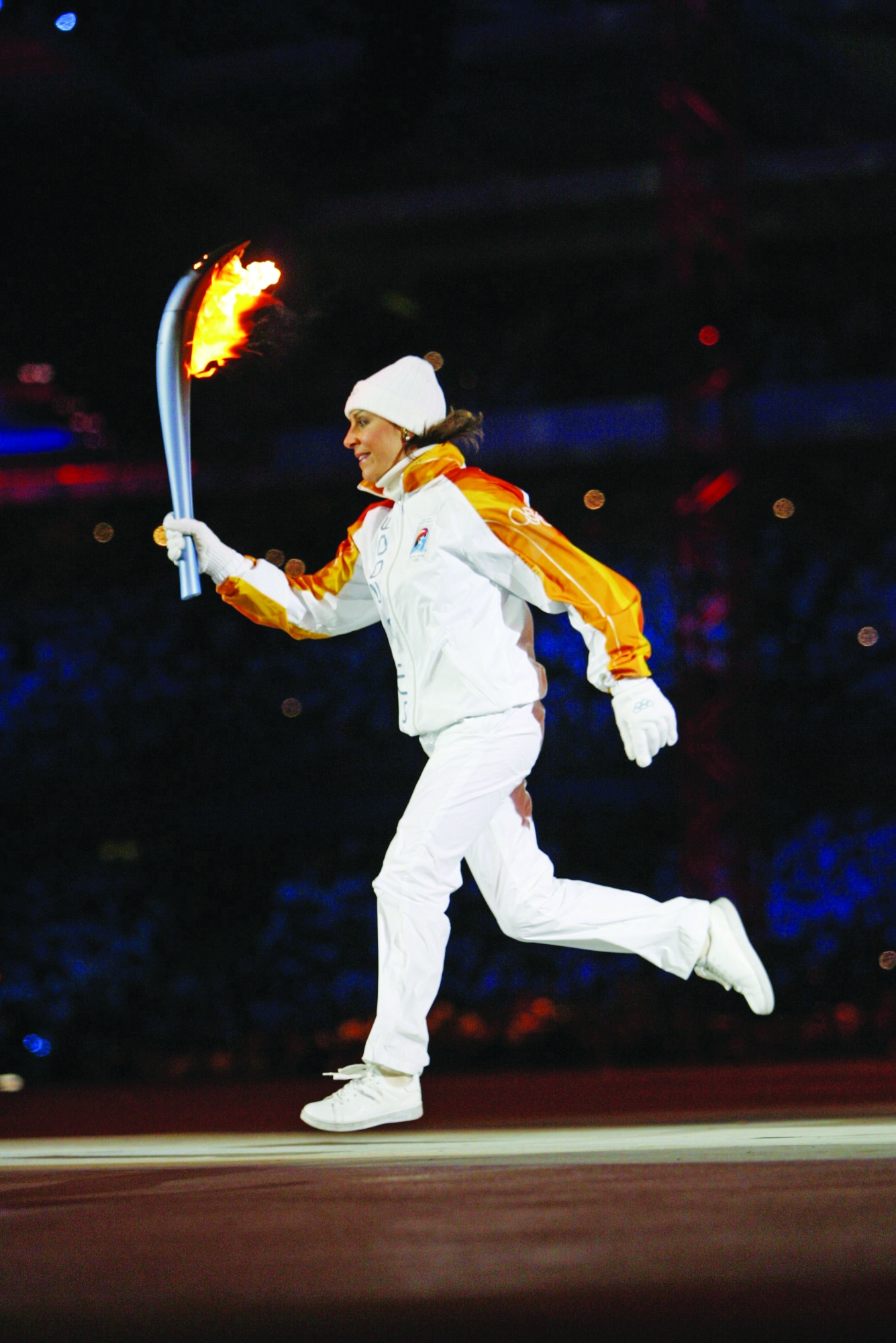 ITALY - FEBRUGEY 10: Opening Ceremony: 2006 Winter Olympics, former Italian Skier Deborah Compagnoni Carrying Olympic Torch Before Games, Turin, Italy 2/10/2006 (Photo by Tielemans/Sports Illustrated via Getty Images) (Setnumber: X75058 TK1 R1)