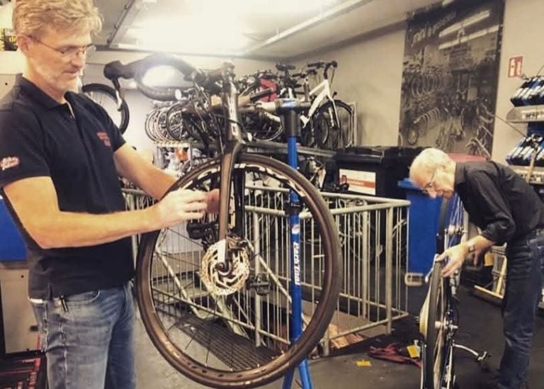 Rick with his father Jan in the workshop of their bike shop (photo: private).