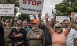 White South Africans who support US President Donald Trump and the South African and American tech billionaire Elon Musk gather for the American embassy in Pretoria for a demonstration. Photo Marco Longari/AFP 