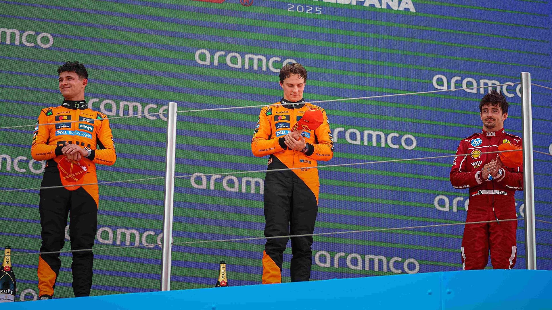 Piatris teammate Lando Norris (left) finished second, Charles Leclerc (right) in Ferrari.