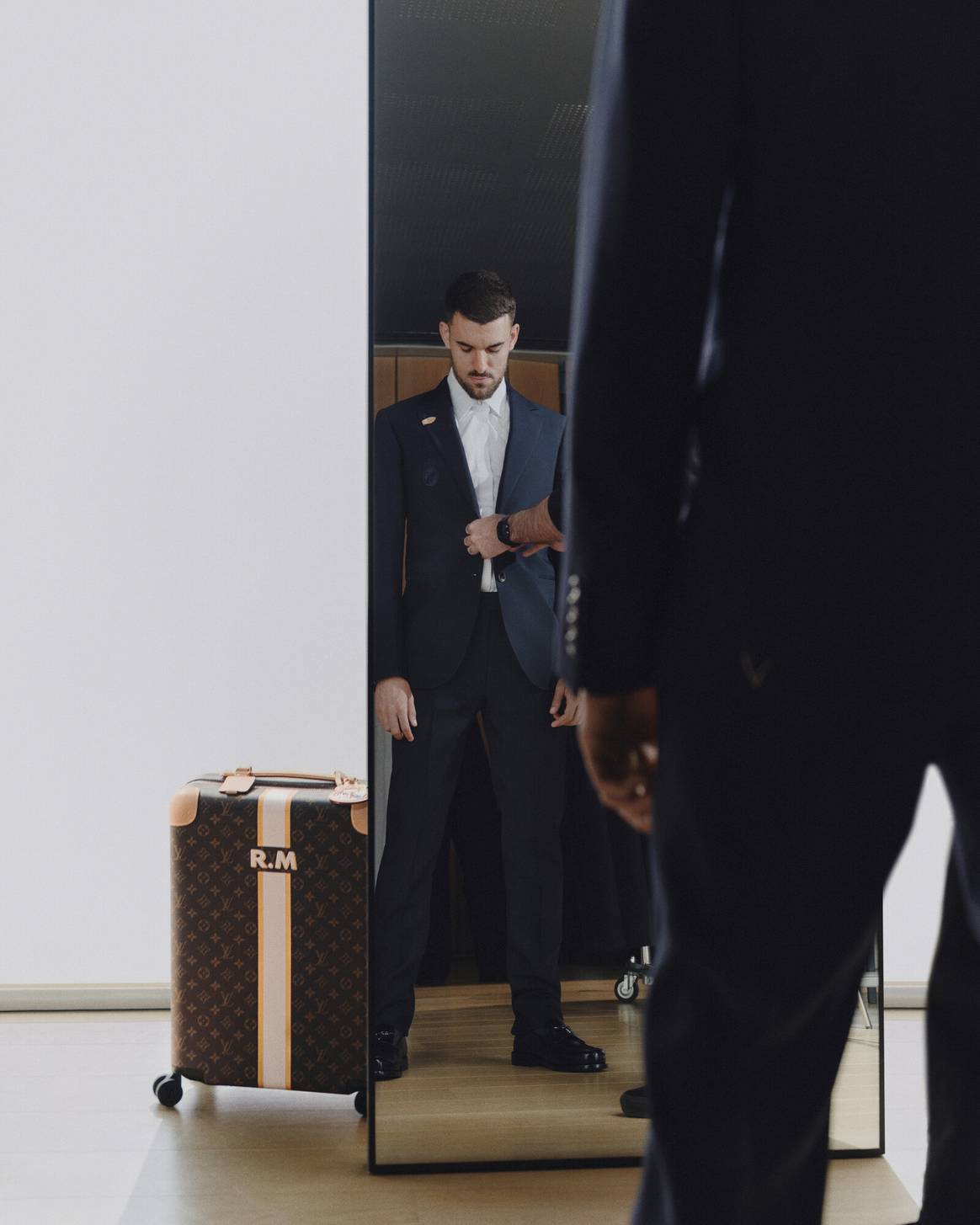 Dani CeBallos in 'Louis Vuitton X Real Madrid' collection with a suitable suitcase