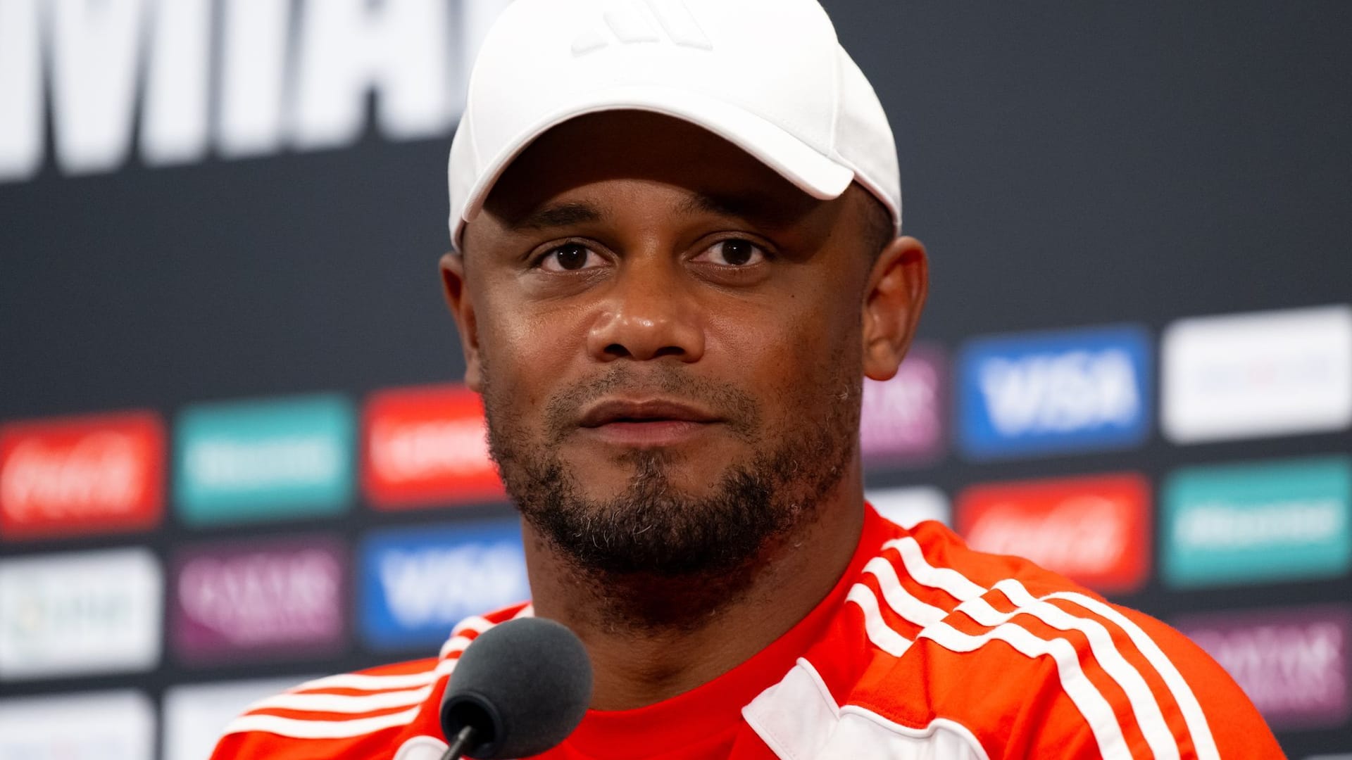 Coach Vincent Kompany from Munich sits on the podium at the press conference during the club World Cup.