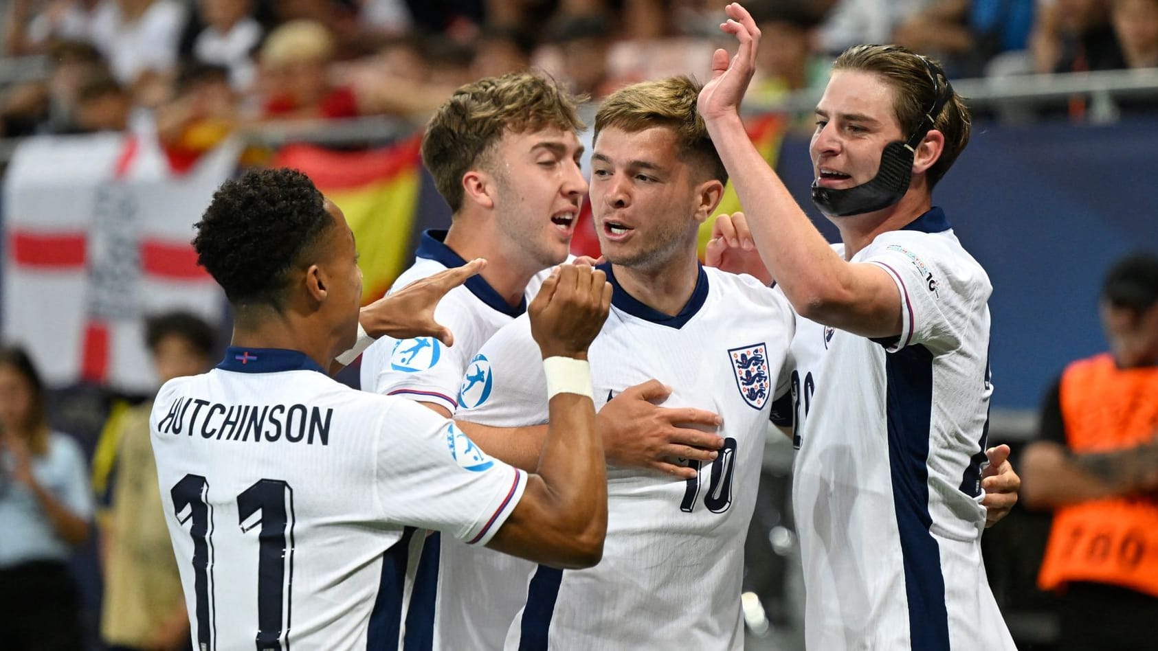 Half -finals! England's U21 players cheer against Spain in the game.