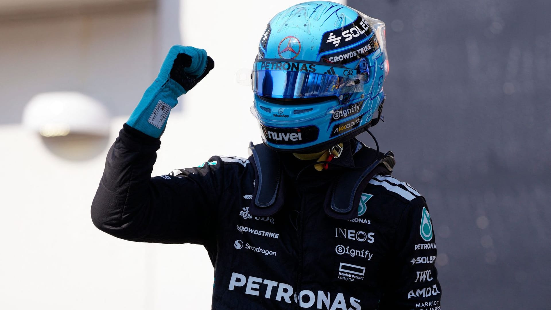 At the very front: Mercedes pilot George Russell celebrates its pole position right after the end of the quaifying.