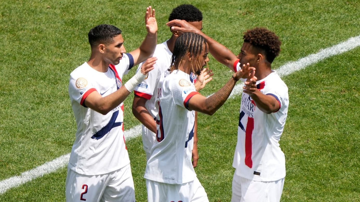 Conditioned victory: The PSG stars cheer with goal scorer Hakimi (left).