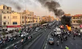 Fire on the street in Tehran, 8 October. 