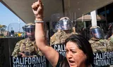 A demonstrator and members of the National Guard in the center of Los Angeles.