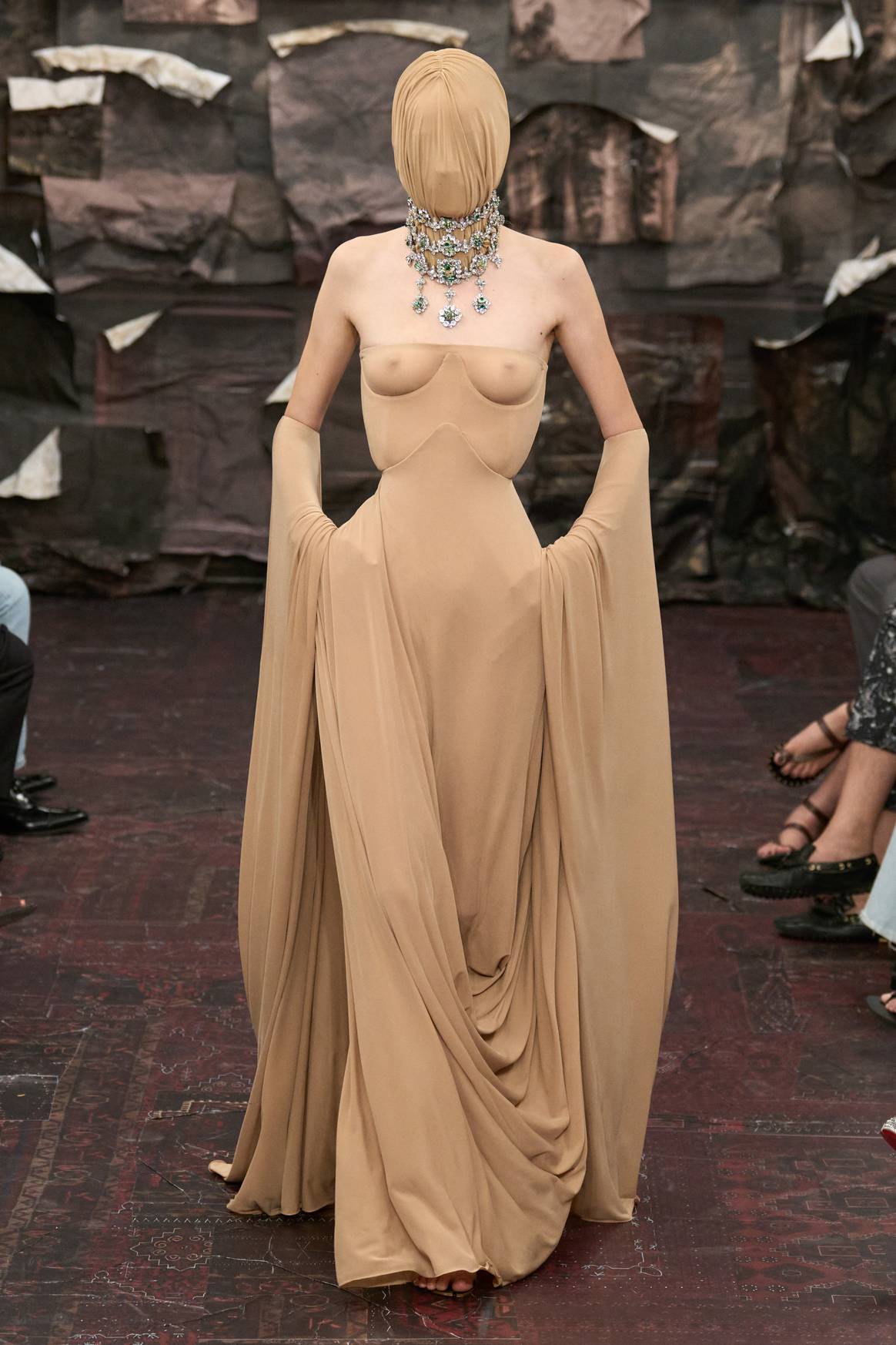 Look 38: A long, sleeveless bust animal dress with corset and skin -colored jersey. Credits: Maison Margiela