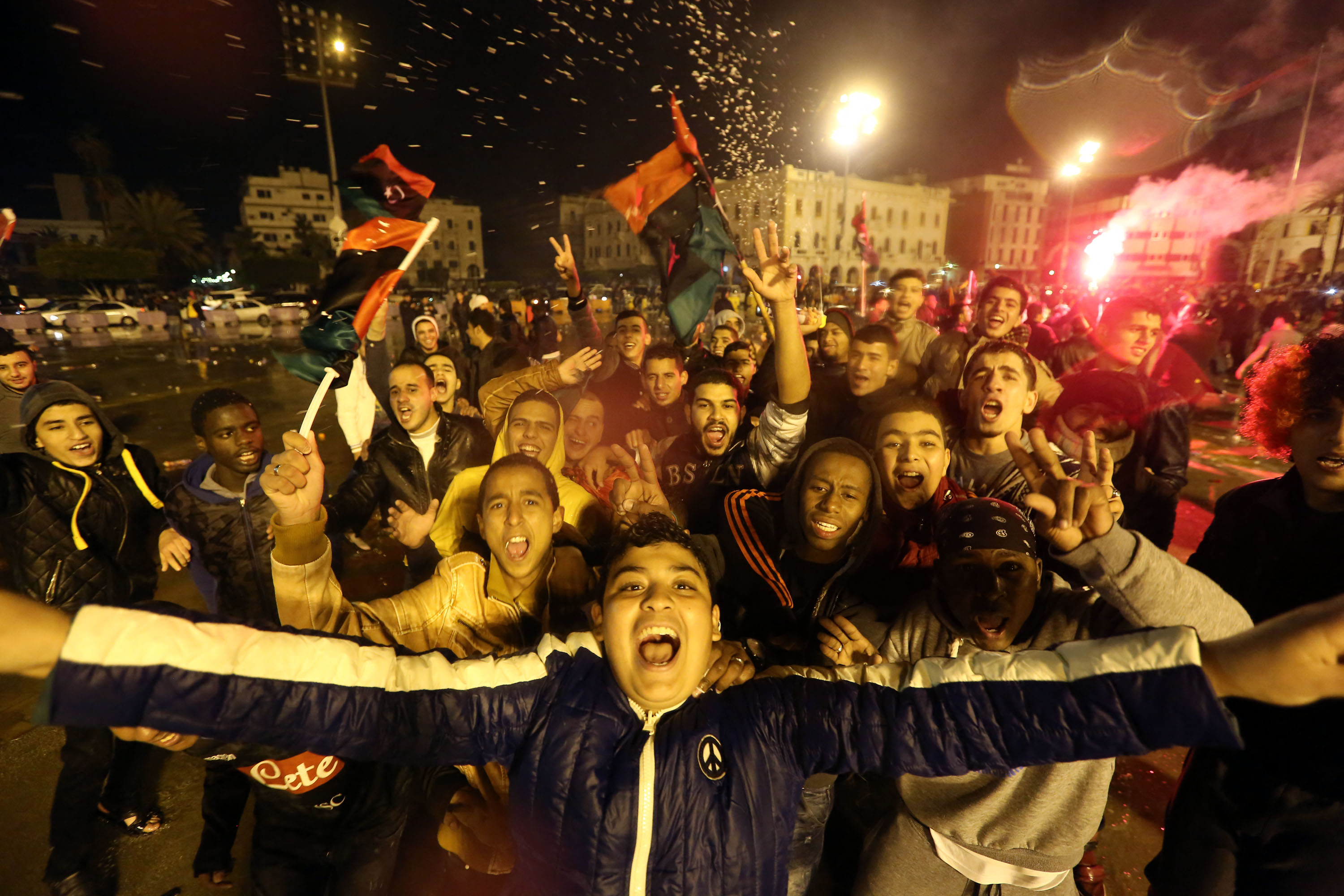 Libyans celebrated in Tripoli on febration 1, 2014 After Their Team Won the African Nations Championship Football Final match Against Ghana in Cape Town, South Africa. AFP Photo / Mahmud Turkia (Photo by Mahmud Turkia / AFP)