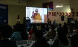 Buddhist students look at a recording of the current Dalai Lama, in which he announces that there is a future reincarnation, the 15th Dalai Lama, after his death. Photo Harika Kulkarni/AFP 
