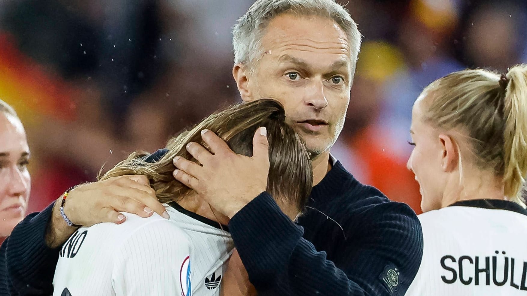 Christian Wück consoles Germany's Jule Brand after the European Championship out against Spain.